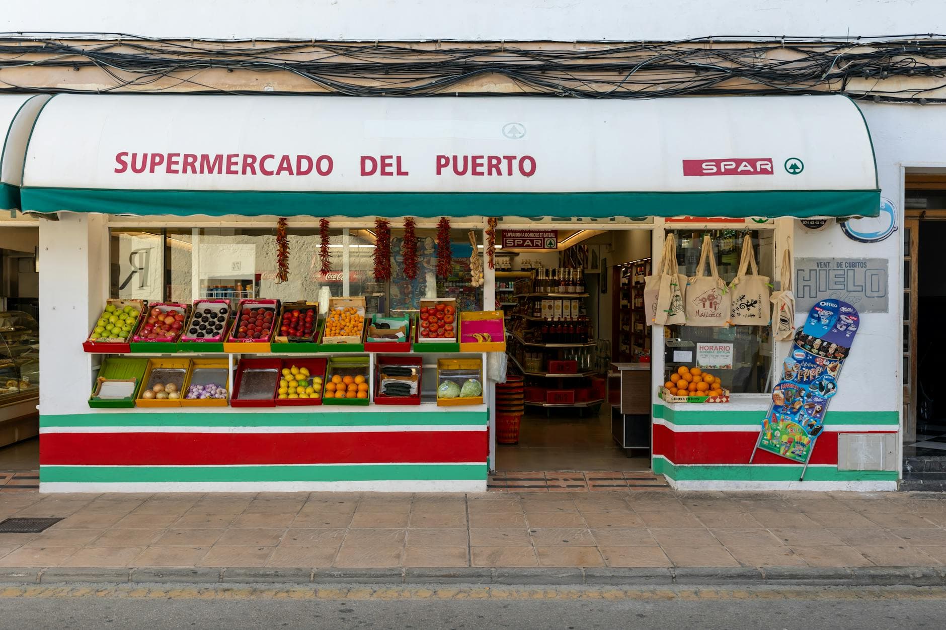 Fresh flowers and produce at store entrance